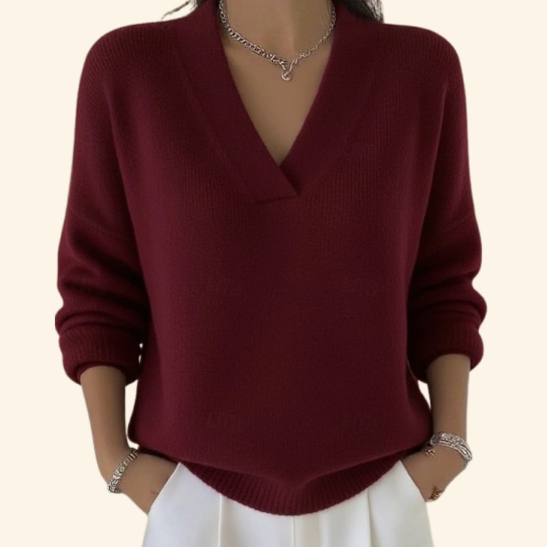Woman wearing a soft V-neck blouse in a relaxed, graceful fit, shown from the front