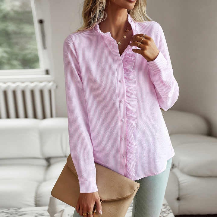 Sheri blouse in white shown in a bright lifestyle setting, styled with minimal accessories