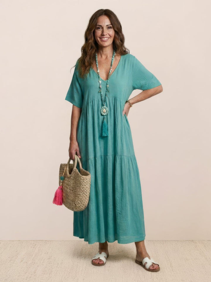 Back view of Sienna maxi dress in army green with flowing tiered skirt