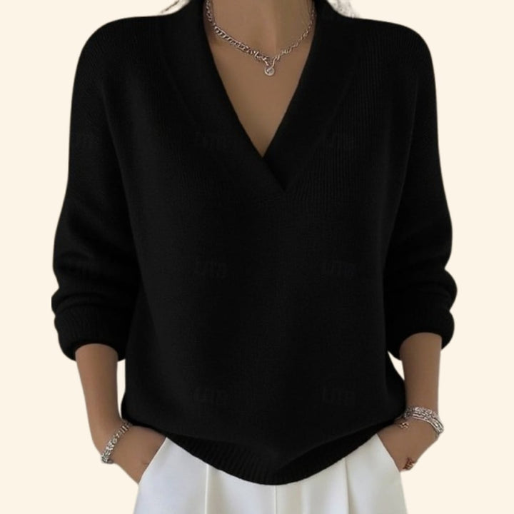 Flat lay of the Sonia V-neck sweater showing the relaxed silhouette and soft knit construction
