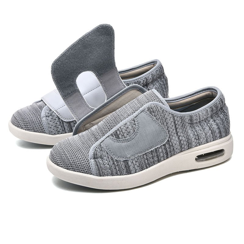 Pair of women's wide fit Velcro slip-on sneakers displayed side by side in all four available colors
