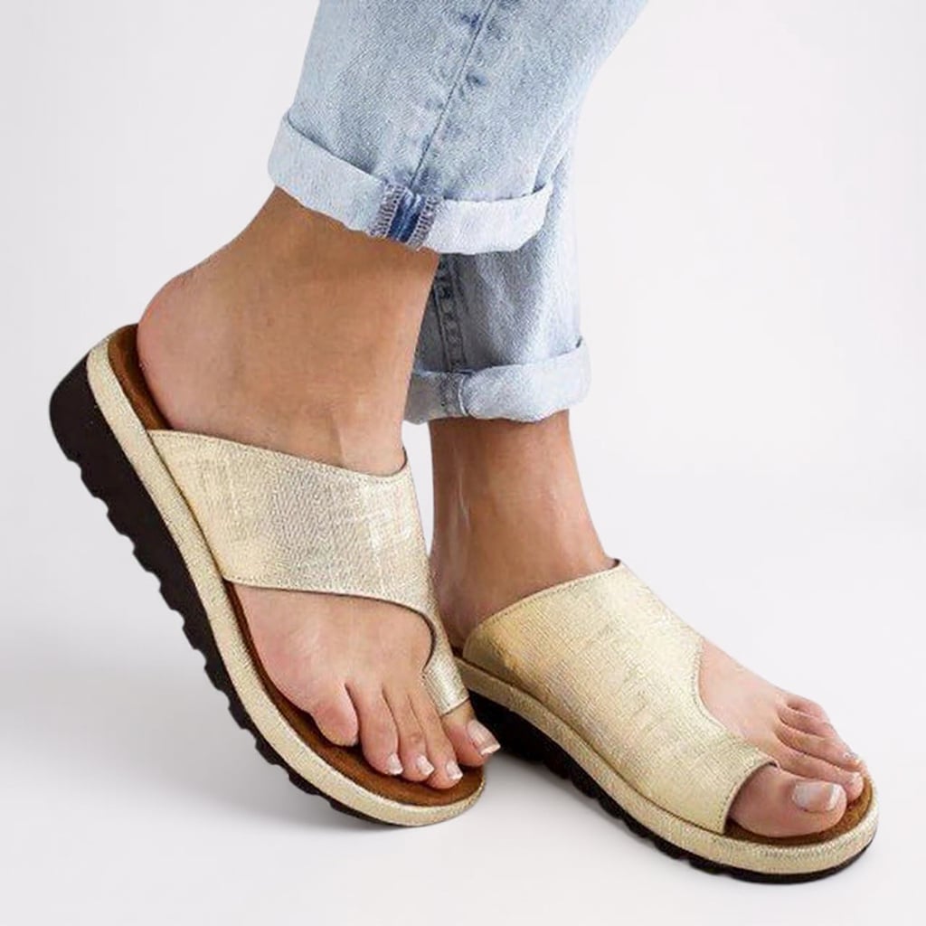 Close-up of the Suki sandal's cushioned sole and toe separator detail