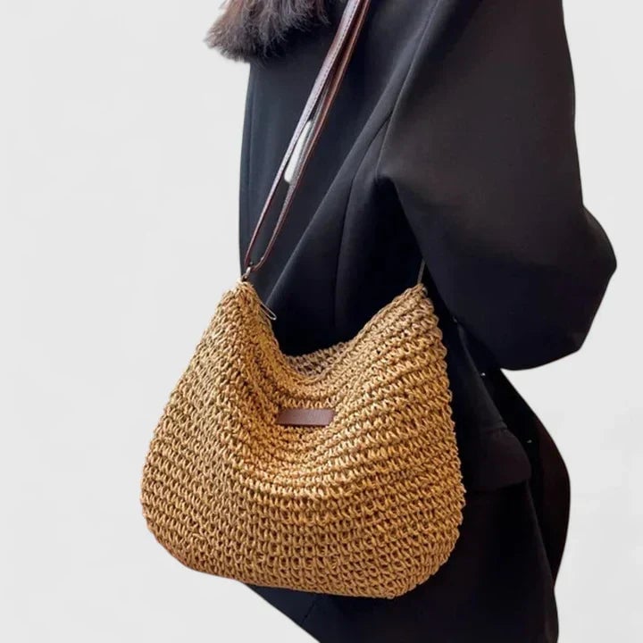 Close-up of the shoulder strap and top of the natural shoulder bag in beige