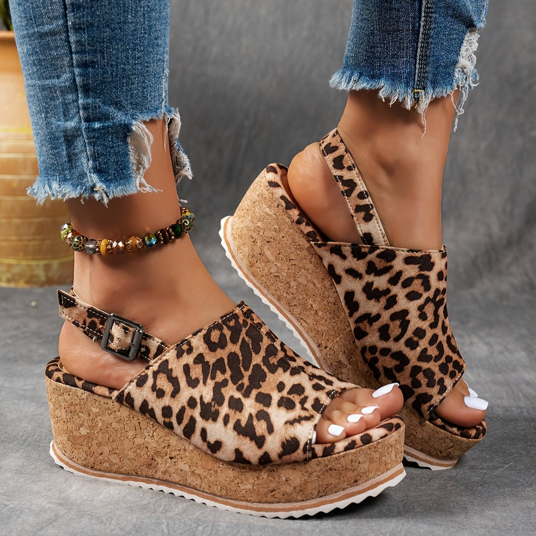 Terra platform sandals in black shown from the side highlighting platform height and buckle detail