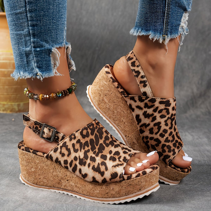 Terra platform sandals in black shown from the side highlighting platform height and buckle detail