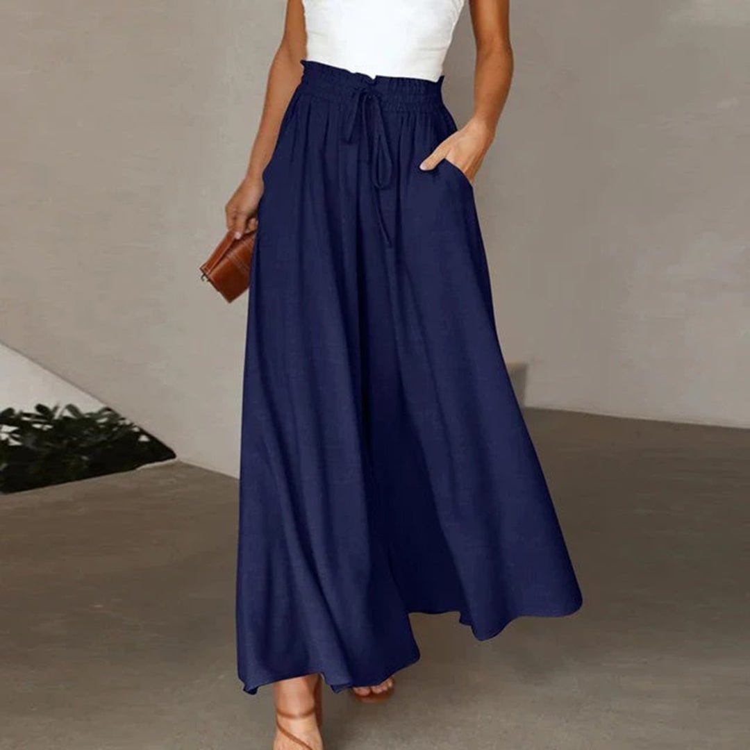Side view of Terra wide leg smocked pants showing the flowing full-length silhouette