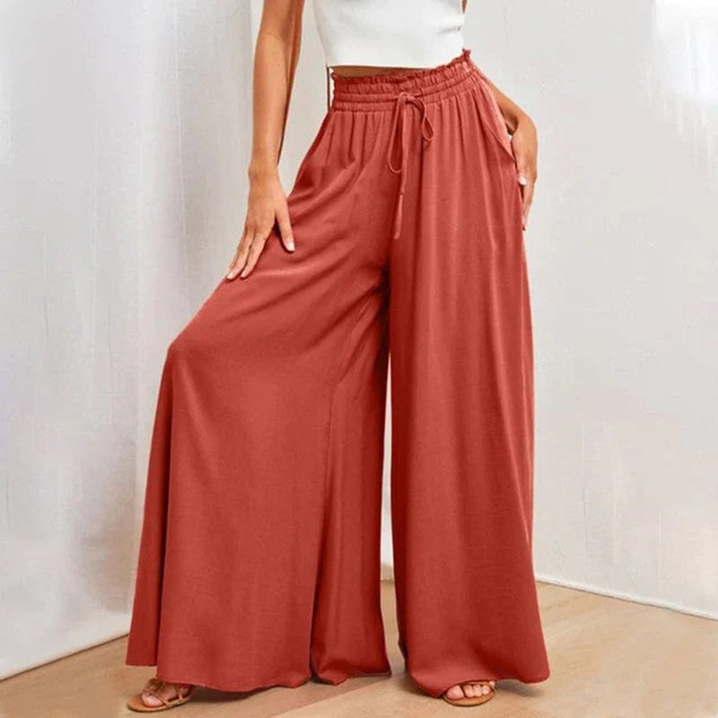 Close-up of the smocked elastic high waistband with self-tie drawstring detail