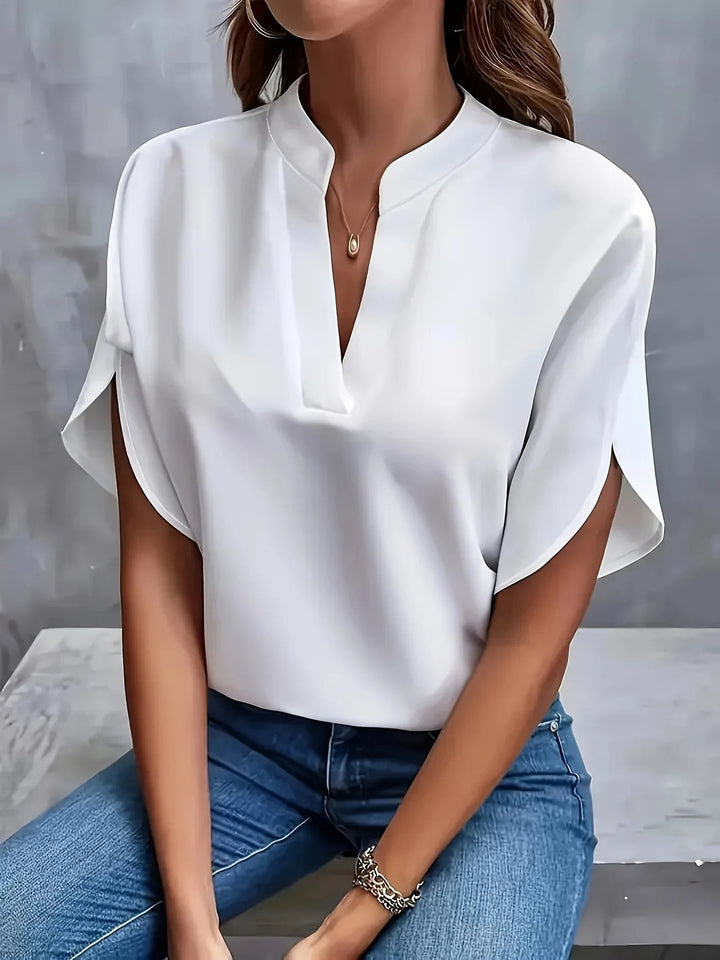 Close-up of the tailored V-neckline and cap sleeve detailing on a chic, lightweight blouse from BobaFashion