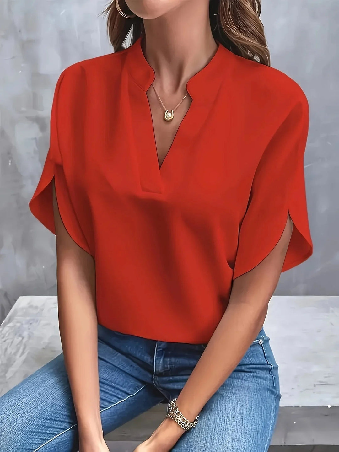 Relaxed styling shot of the BobaFashion V-neck blouse paired with jeans for a casual weekend look