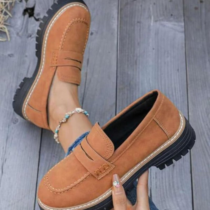 Close-up of the thick lug sole on Thalia chunky platform loafers in brown