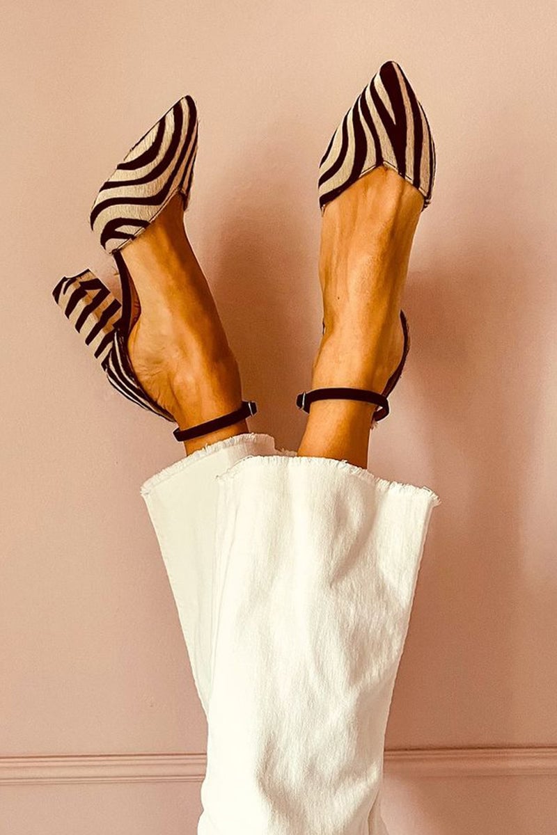 Women's khaki zebra-print adjustable heeled sandals with cushioned insole and ankle strap, shown from a front three-quarter angle