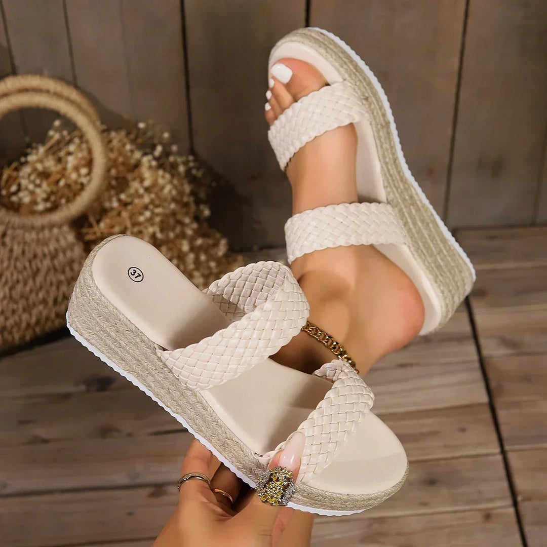 Theodora black wedge sandals paired with straight-leg jeans, lifestyle photo