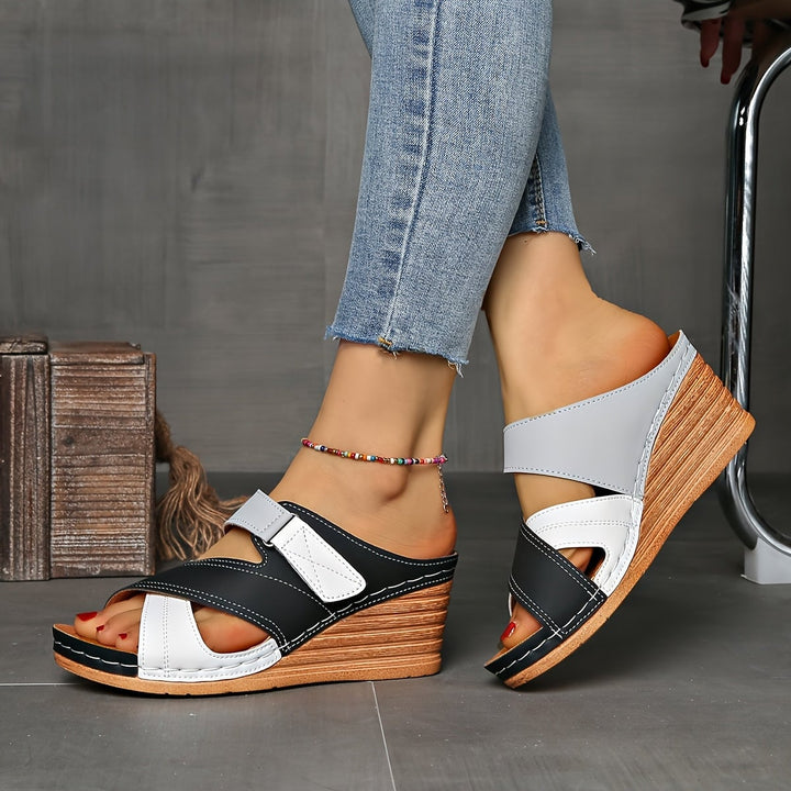 Angled view of Tulip wedge slides in sky blue pink highlighting the wedge height
