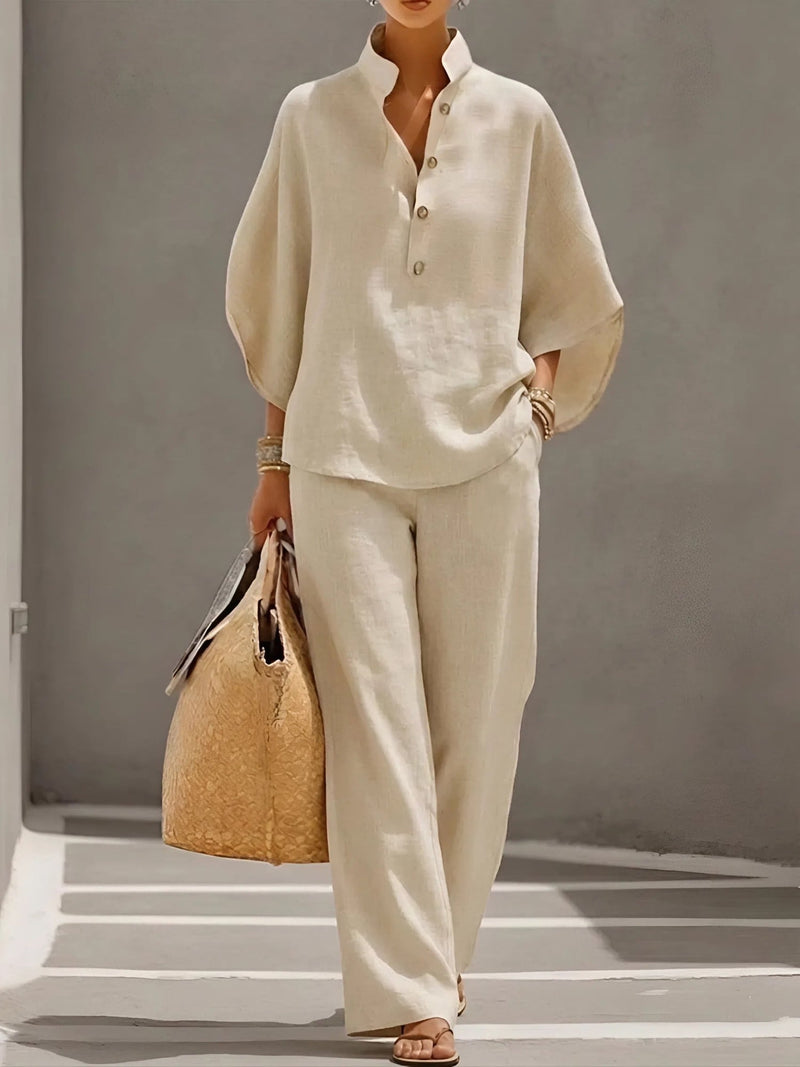 Woman wearing the Valentina button-up wide leg set in beige with a relaxed collar top and flowing wide-leg pants
