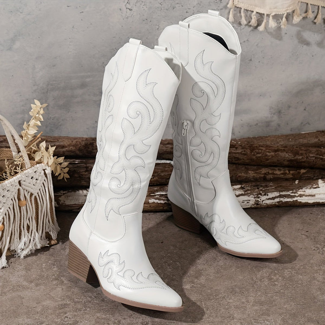 Overhead flat lay of all Winter Grace boot colors on a light neutral surface