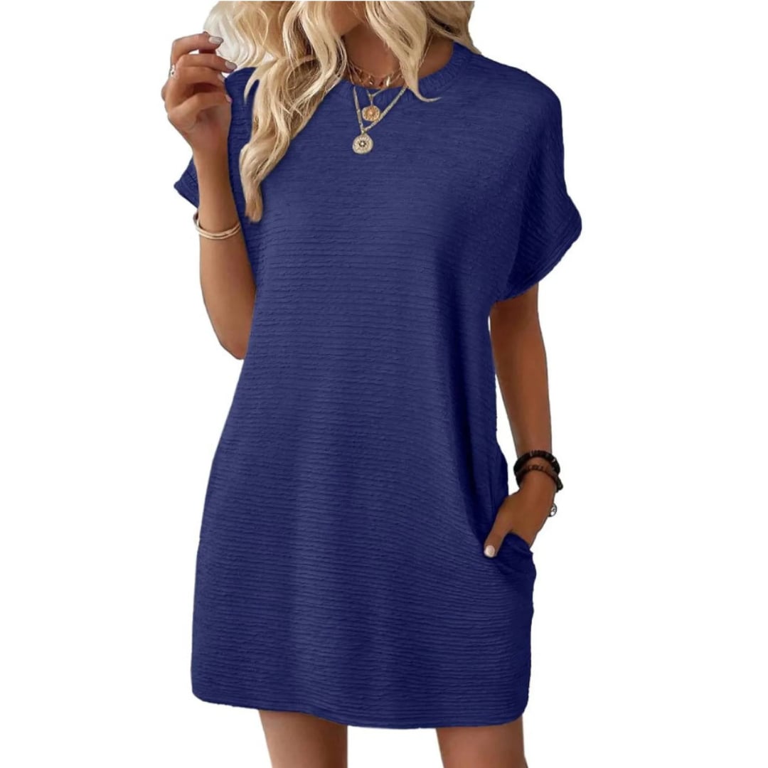 Close-up of the subtle horizontal ribbed texture on the Vivid mini dress in Dark Blue