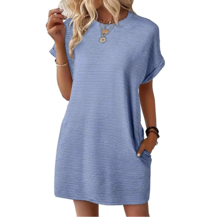 Vivid ribbed mini dress in Light Pink laid flat showing overall shape and length