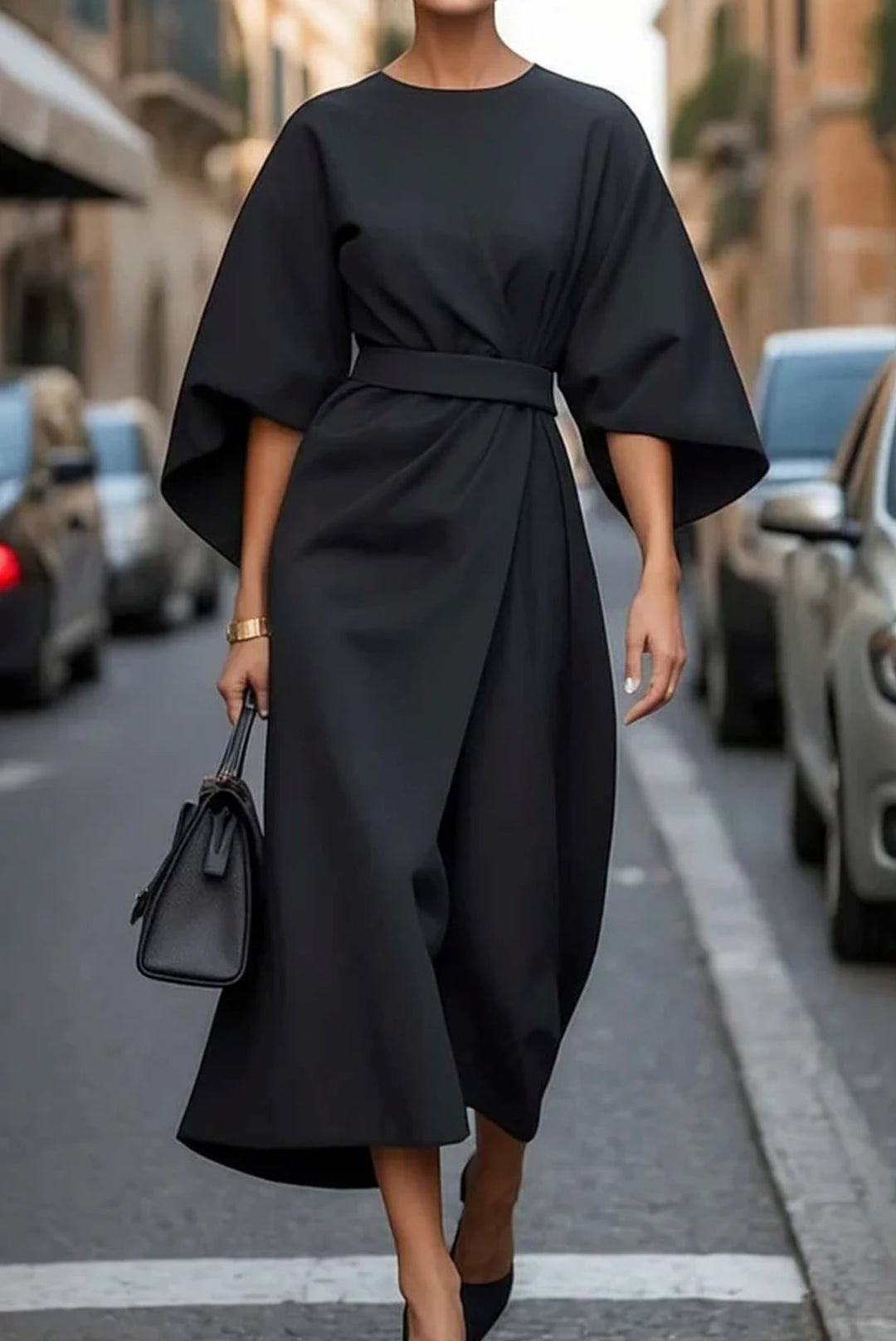 Woman in the Wendy dress in burgundy styled with heels for an evening occasion