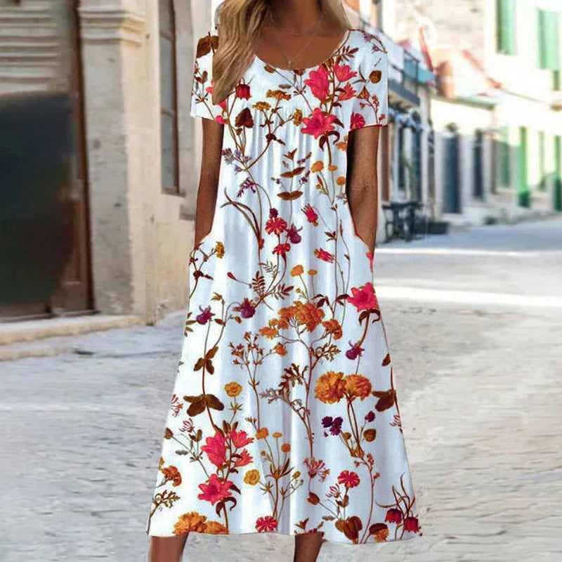 Close-up detail of the botanical floral print fabric on a short sleeve midi dress