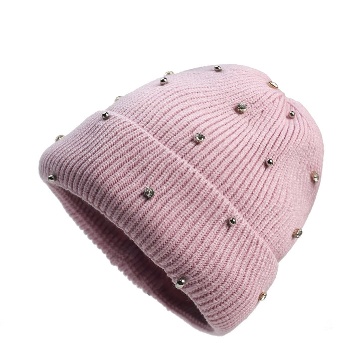 Detail shot of the soft stretchy knit fabric and sparkle beading on the cozy beanie