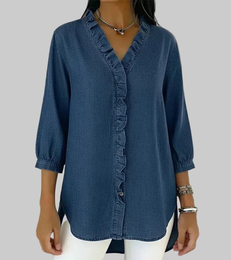 Woman wearing a ruffle V-neck 3/4 sleeve blouse in dark blue with a relaxed fit